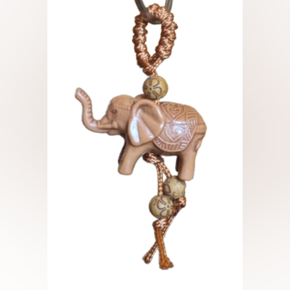 NEW tan carved poly resin elephant w/designs carved in the sides on a looped - Picture 3 of 3